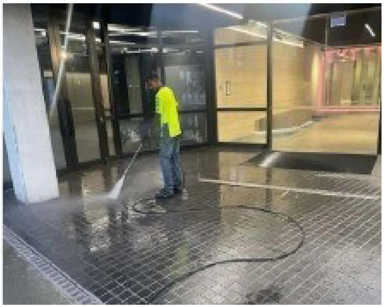 Owner’s photograph of the West Maintenance team waterblasting an exterior area
